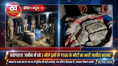 Prayagraj police recovering blue drums filled with cash from underground in Nawabganj